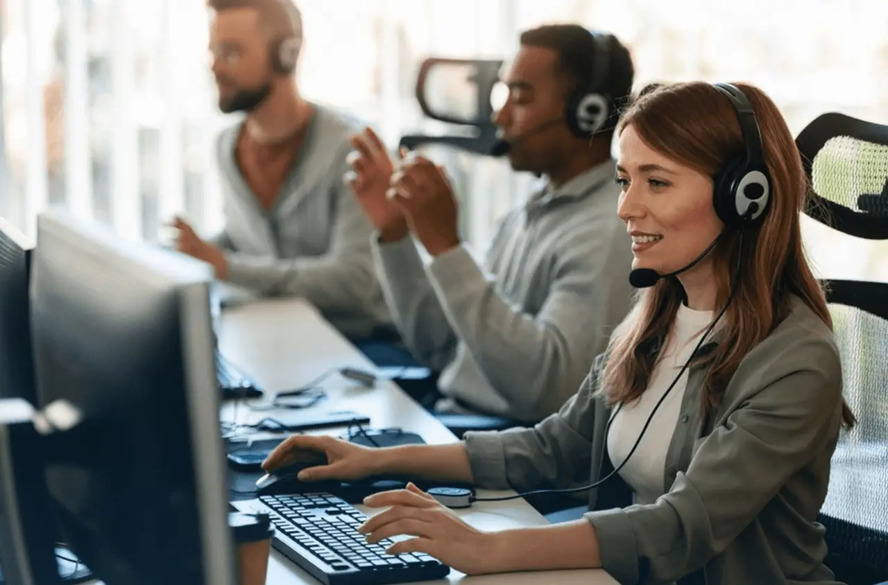 Why More Businesses in Englewood NJ Are Choosing Managed IT – Managed IT Services, Consulting, and Support for Businesses and Non Profits Customer support team at E-Valve Technologies providing managed IT services, using headsets and computers in a modern office setting.